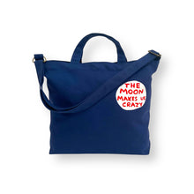 Lade das Bild in den Galerie-Viewer, David Shrigley - The Moon Makes Us Crazy - Cross Body Bag
